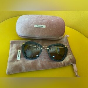 MIU MIU  

SMU 10N USZ-5J2 Womens Blue Brown Cat-eye Sunglasses